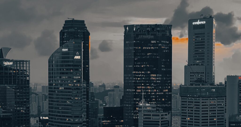 A view of a city at night from the water — featured photo for Web Development in Singapore for Startups and Small Businesses: