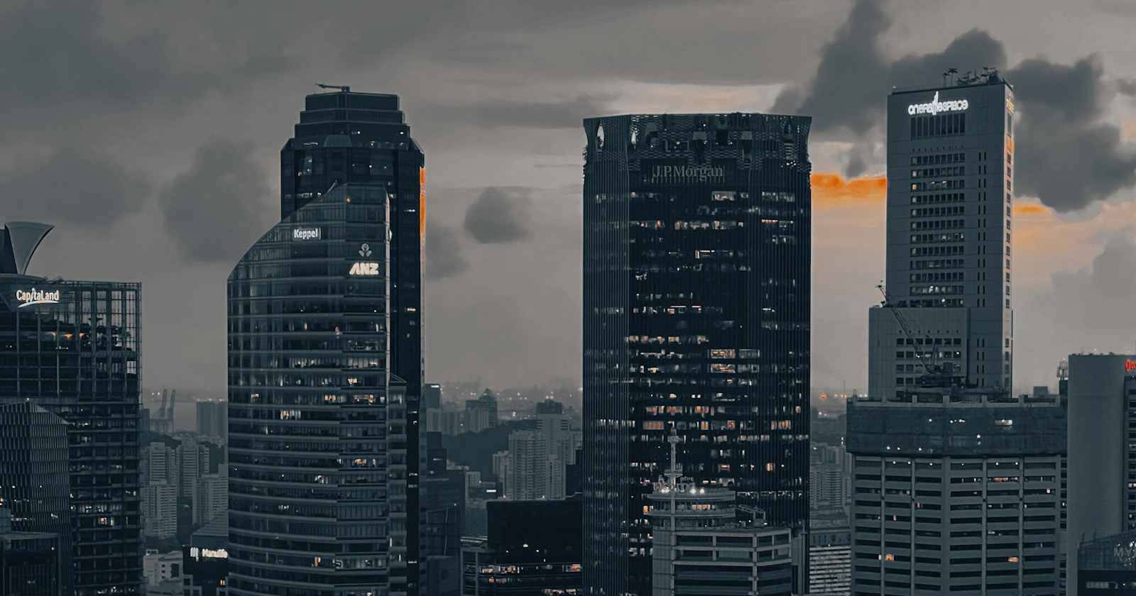 A view of a city at night from the water — featured photo for Web Development in Singapore for Startups and Small Businesses: